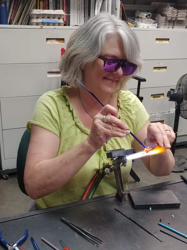 Janice Peacock working at the torch making lampwork glass beads